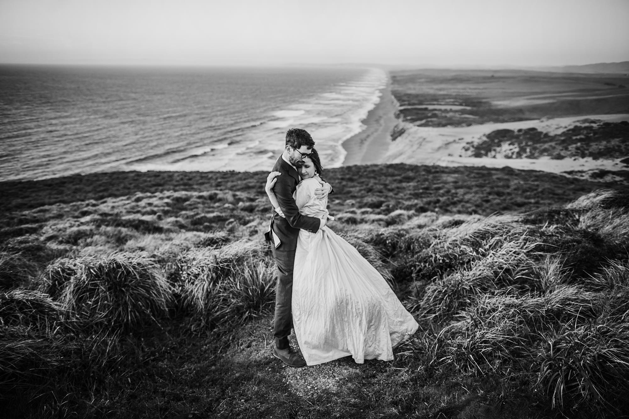 BW photo of a sweet moment overlooking the beach during their Point Reyes elopement.