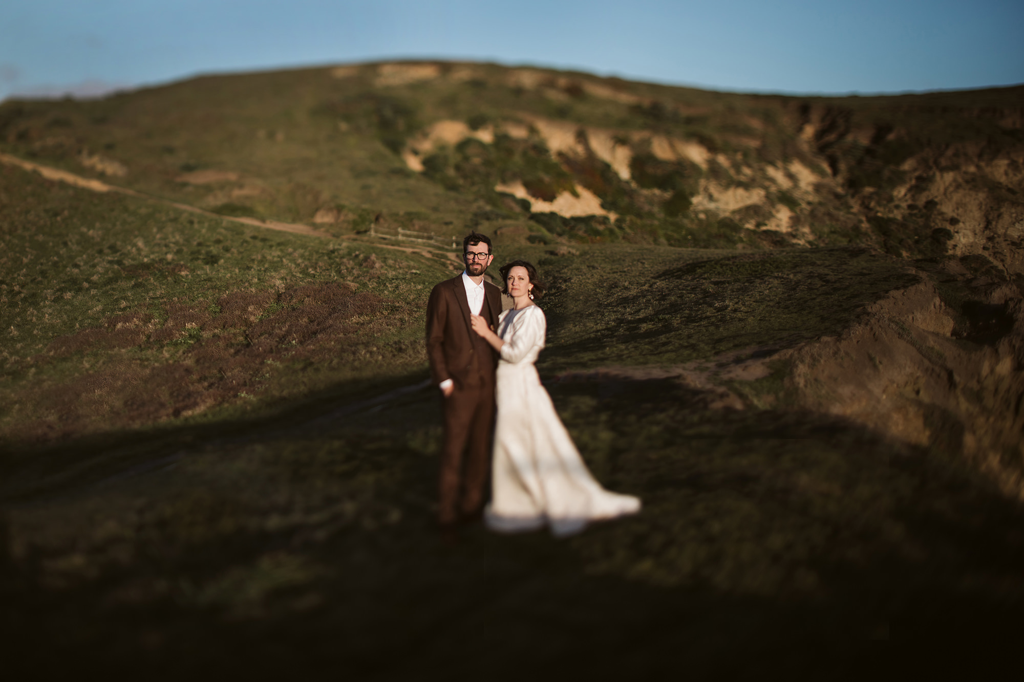 Bride and groom in the sunset during their Point Reyes elopement.