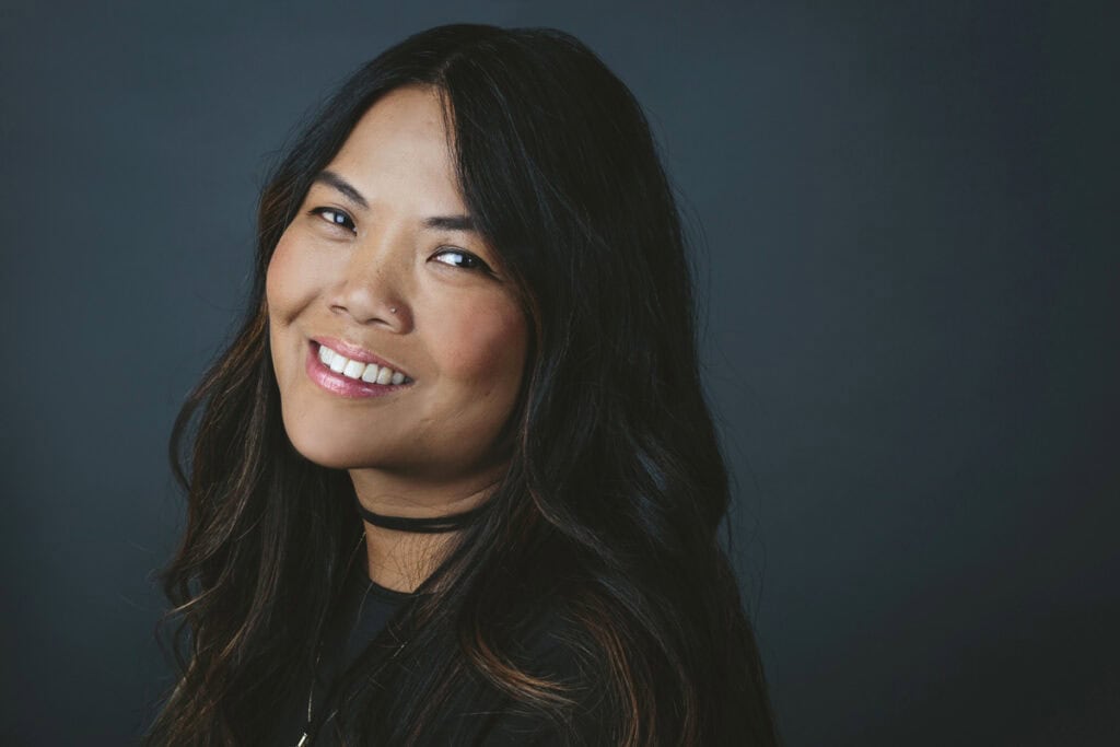 High-quality professional headshot of a confident woman for branding and corporate profiles.