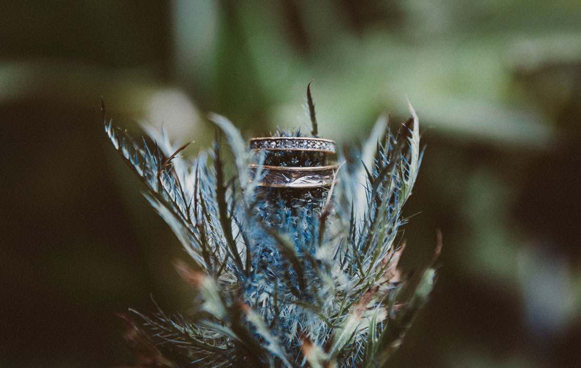 Photo of ring on a beautiful flower at a Carmel Wedding.