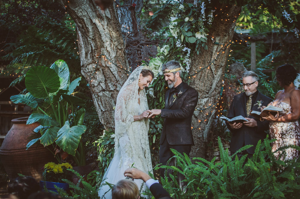 Bride and groom exchange rings at heartfelt wedding ceremony at a California wedding by Becca Henry Photography.