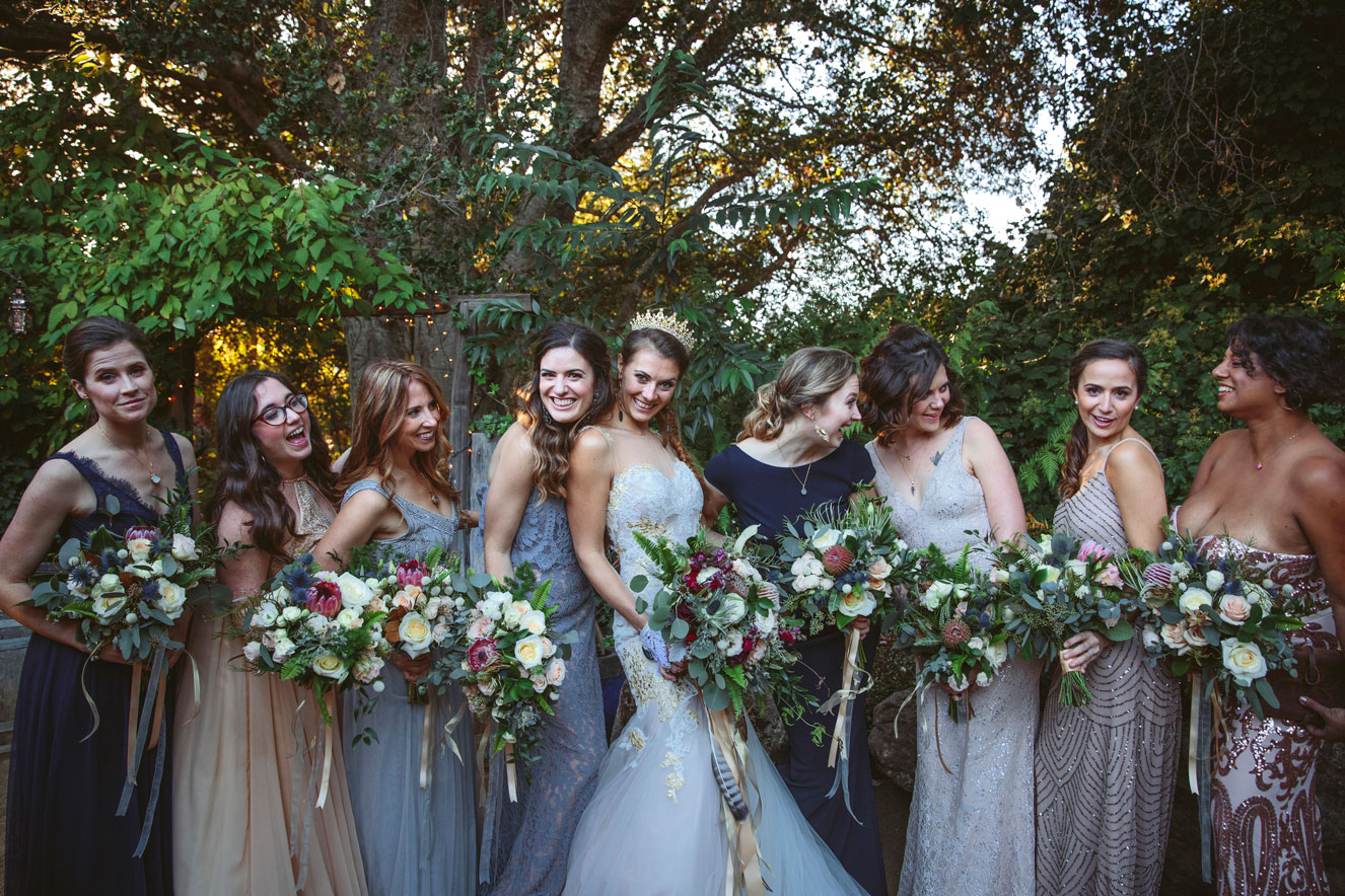 Photo of wedding party laughing at this elegant California wedding.