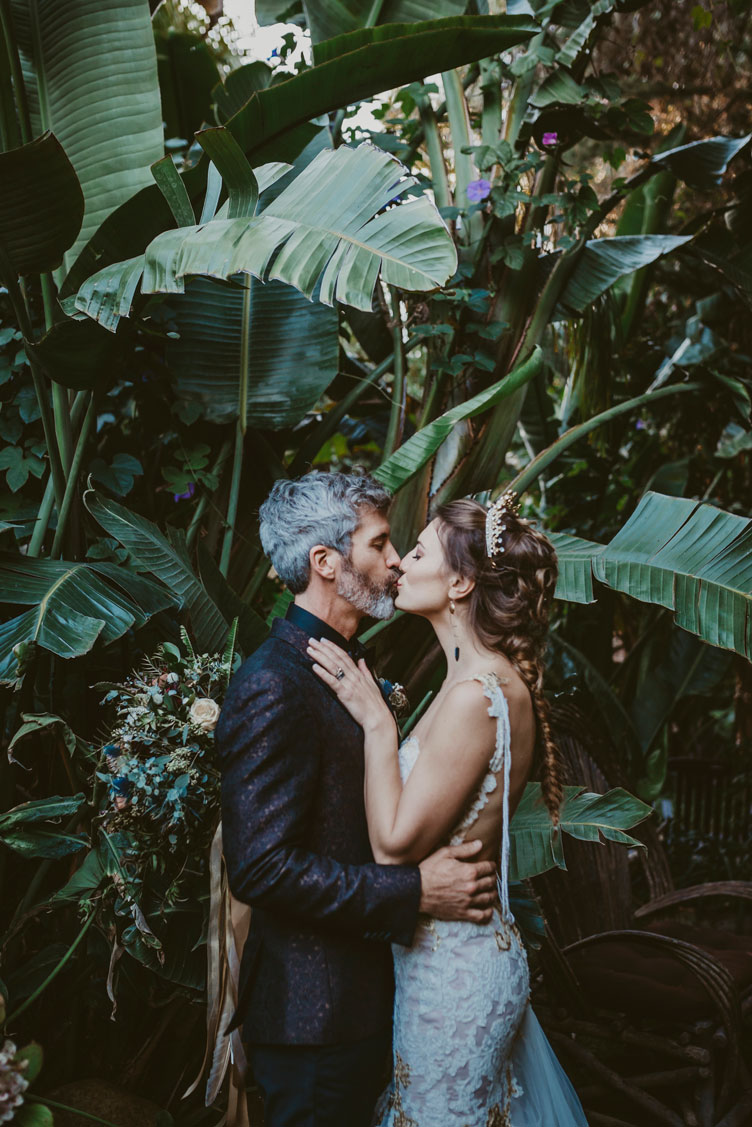 Sweet kiss between the bride and groom at this Game of Thrones meets Red Carpet themed wedding.