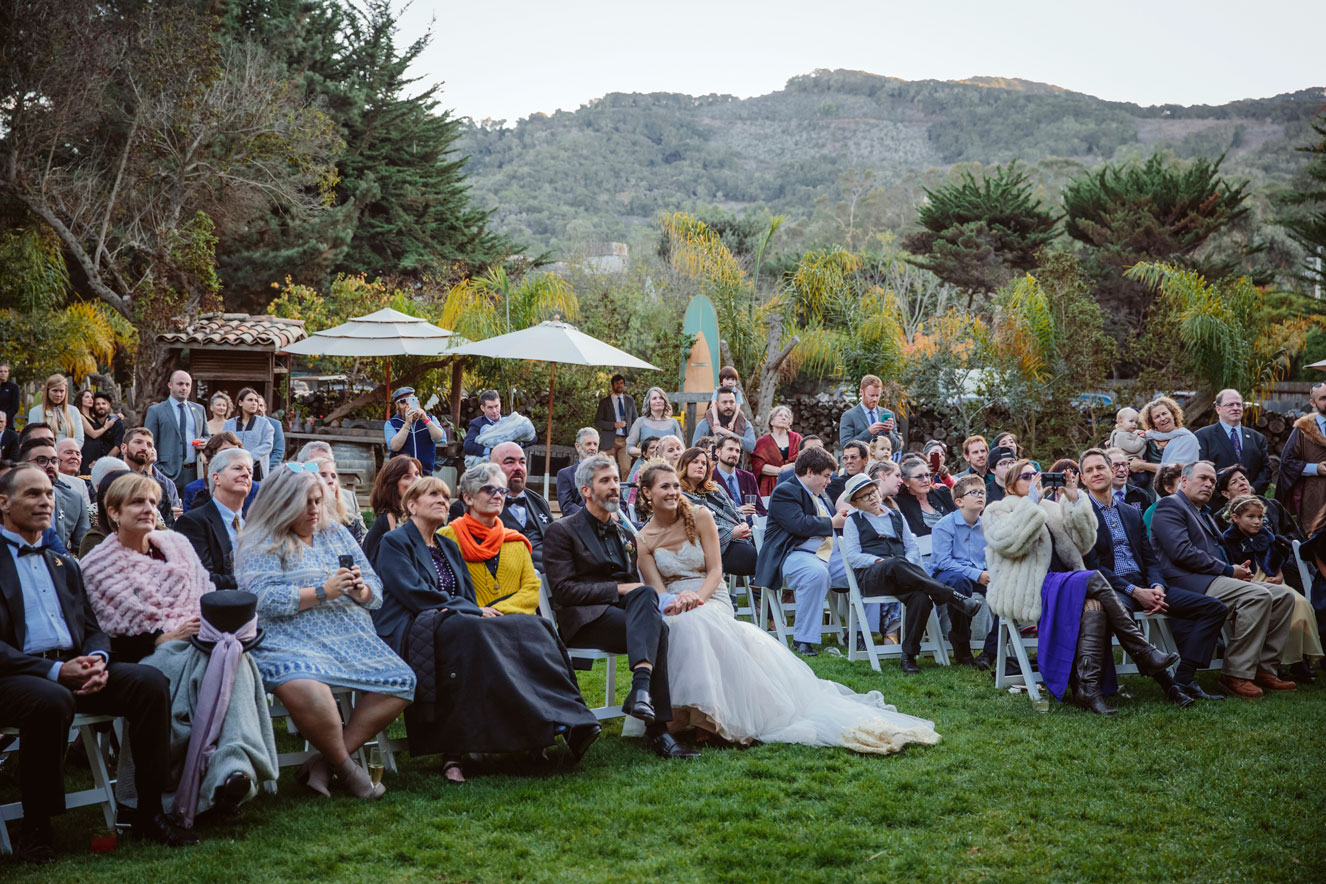 Wedding guests watch acrobatics at this off beat , elegant Holly Farms Wedding