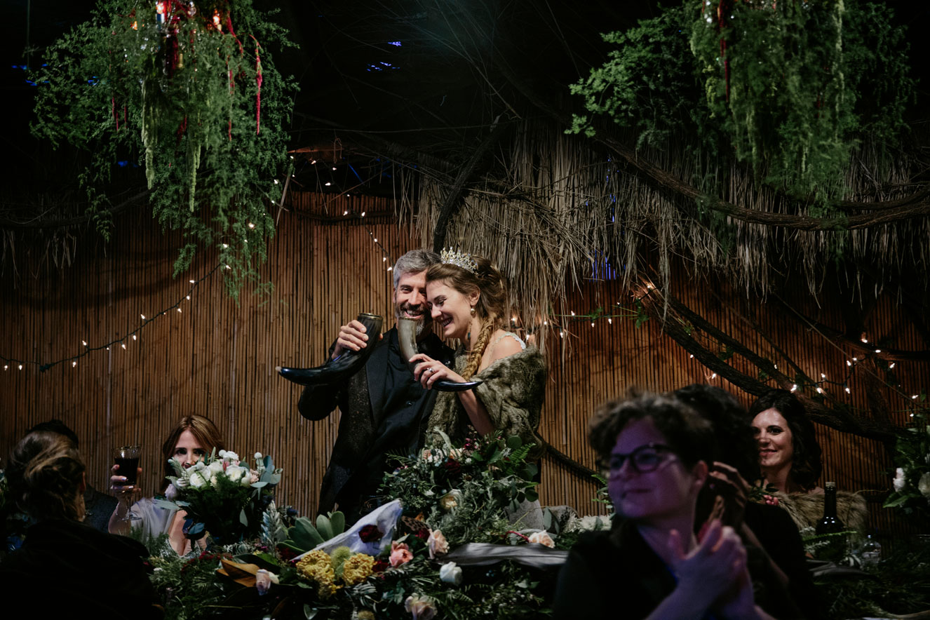 Bride and groom toast their guests at this elegant reception with lush, tropical vibes