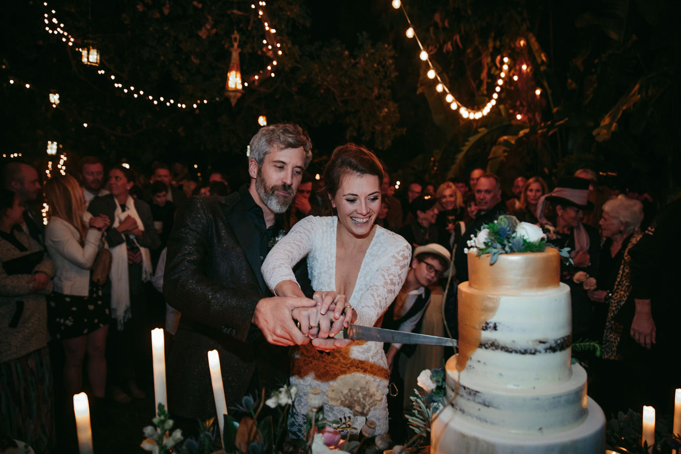 Bride and groom cut the cake