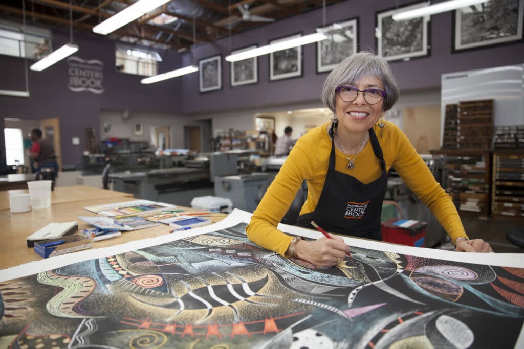 Art studio woman creating colorful painting for branding site.