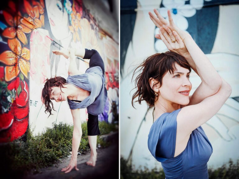 Yoga pose with mural art background, showcasing vibrant street art and fitness photography.