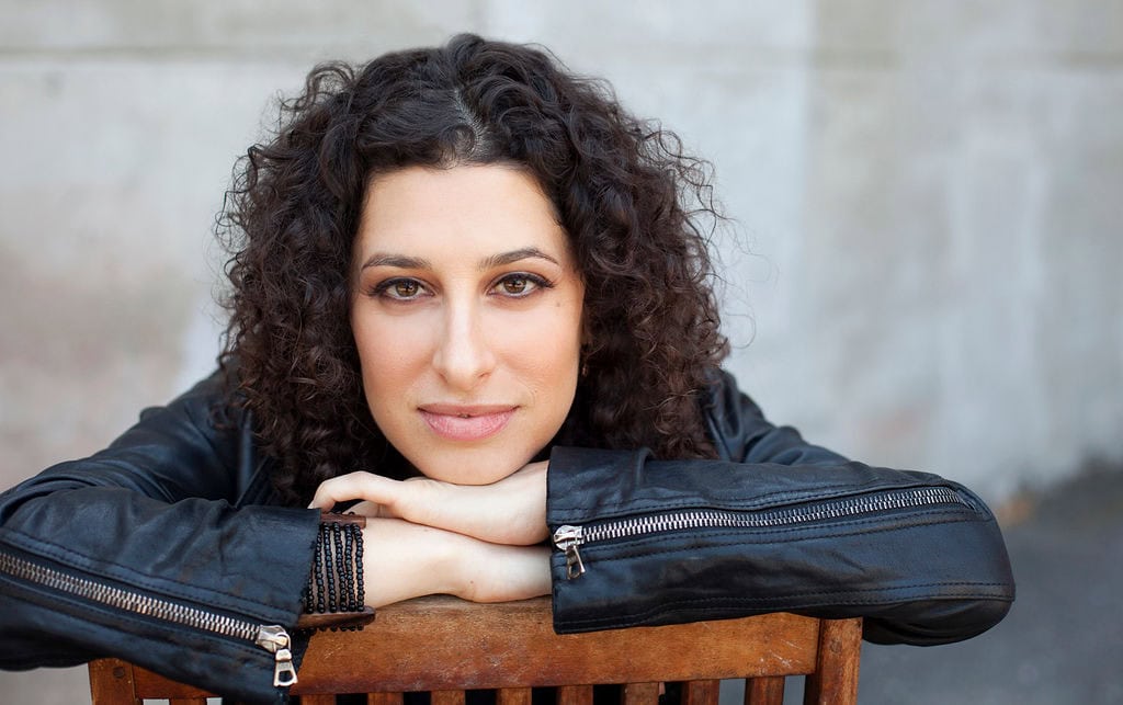 Portrait of a woman with curly hair for new branding website.