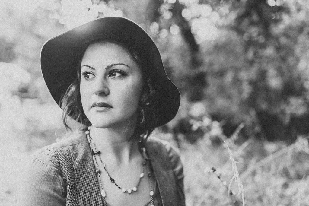 Portrait of a woman wearing a hat for New BH branding website.