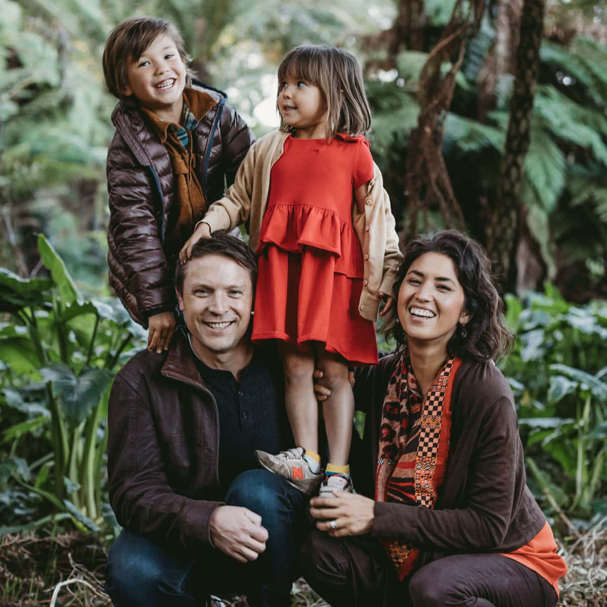Family portrait in lush garden setting for new branding website.