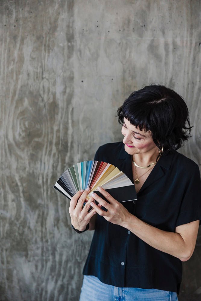 Woman with color swatches for branding and design inspiration.