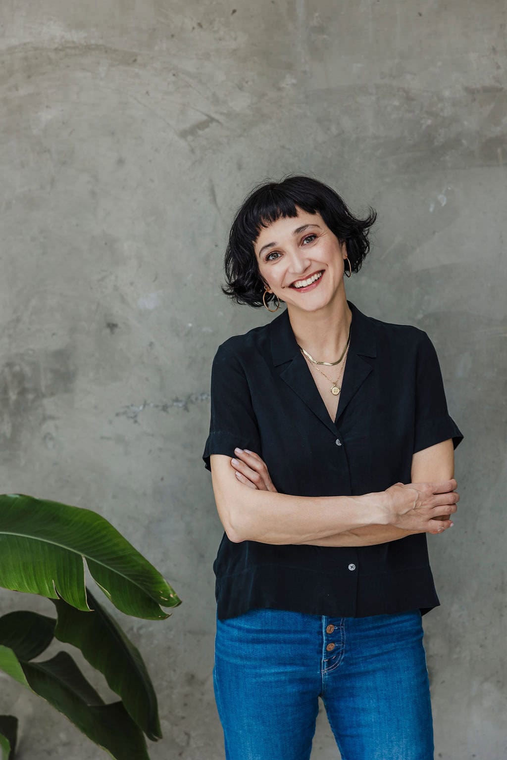 New BH Branding Site - Professional portrait of a woman with short black hair, smiling confidently a.
